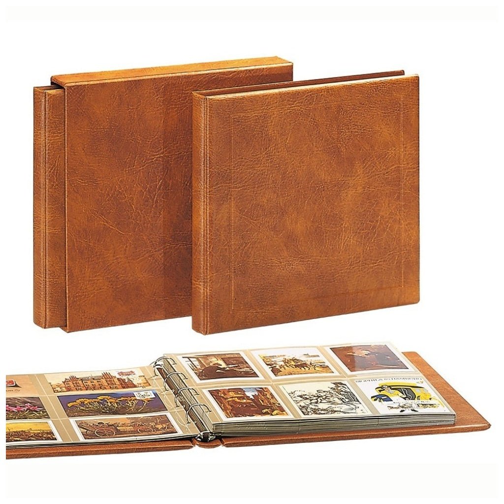 Two tan 'Maxi XL Luxus system' albums with an open album showing pages displaying postcards on a white background