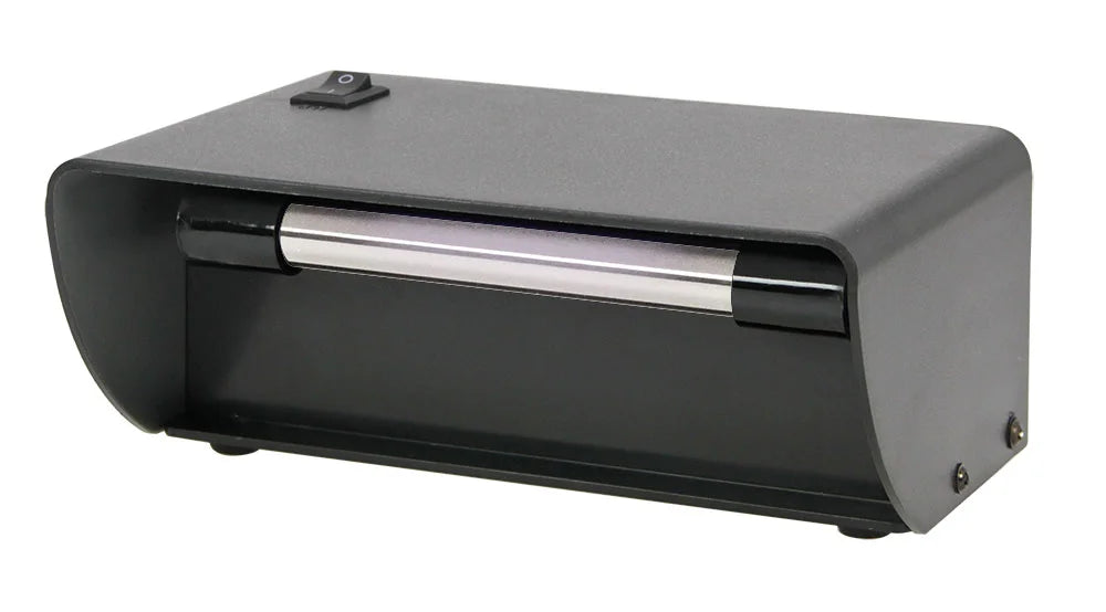 Black desktop UV lamp with on/off switch on a white background