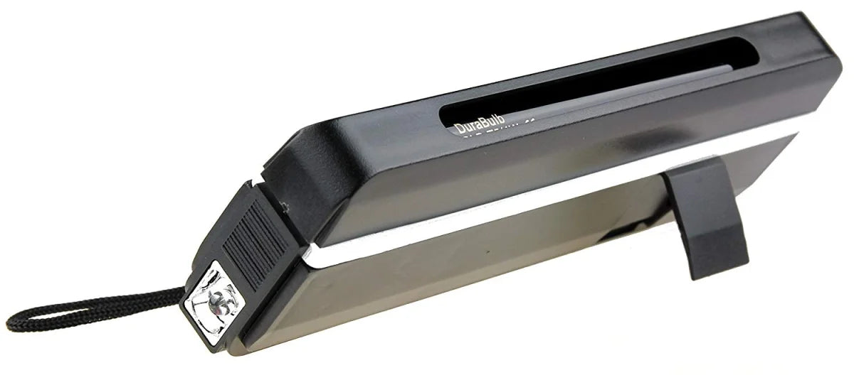 Black handheld UV Lamp device with built in flashlight and stand on a white background