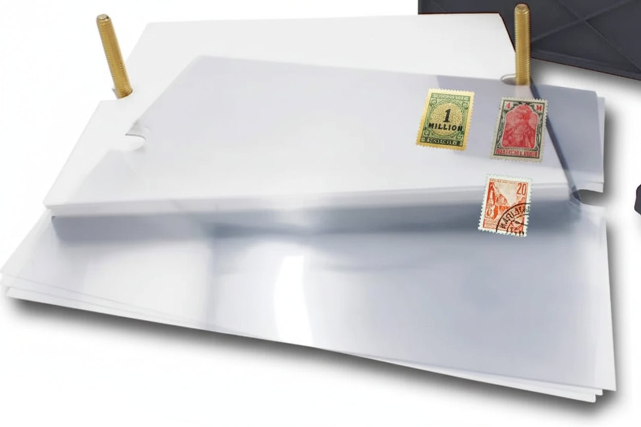 Close up of the manual stamp drying press vinyl and blotting sheets with stamps on a white background.