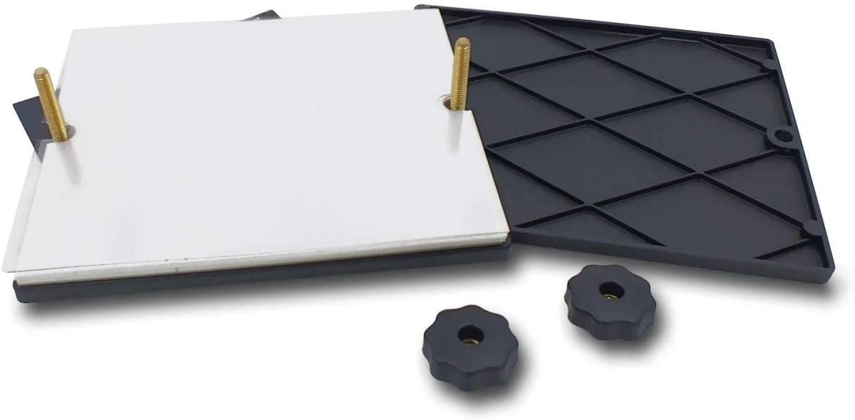 Manual stamp drying press shown taken apart to expose the vinyl sheets and blotting sheets.