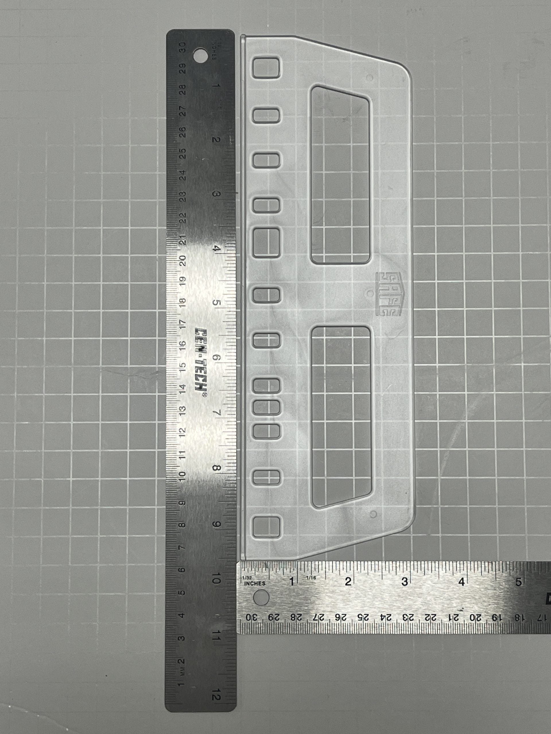 One clear heavy duty album sheet lifter with various ring spacing and album format with silver metal rulers