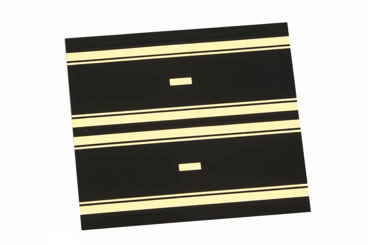 Black and gold embossed label with hyphen for album spine labeling/organizing on a white background.