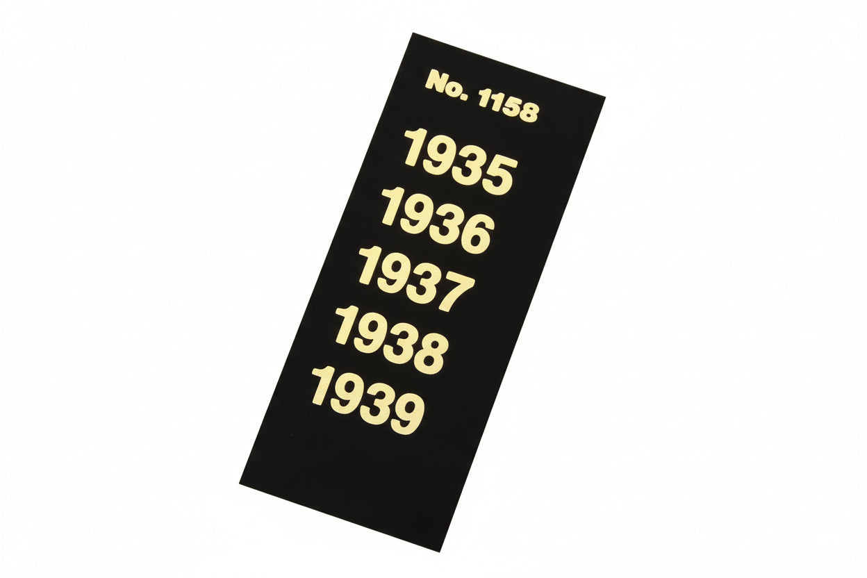 Black label strip with gold text displaying years 1935 to 1939 for album spine labeling/organizing on a white background
