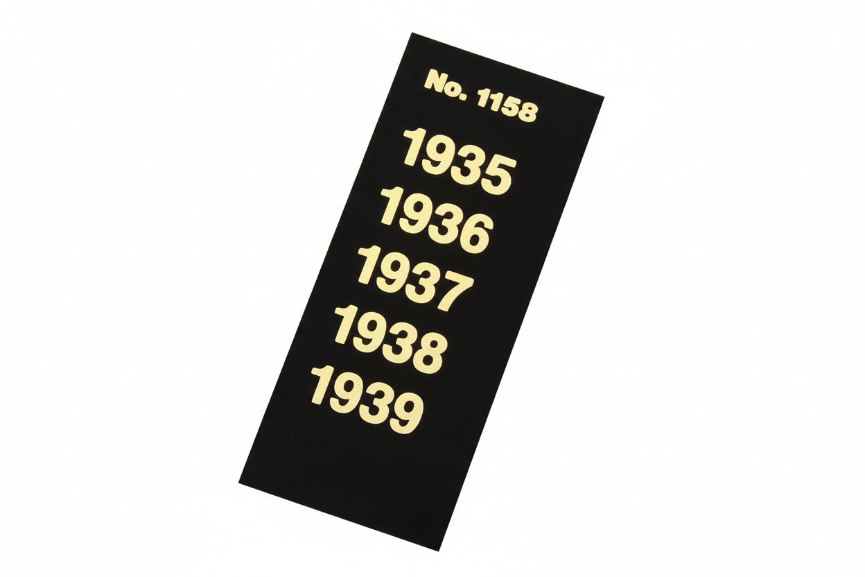 Black label strip with gold text displaying years 1935 to 1939 for album spine labeling/organizing on a white background