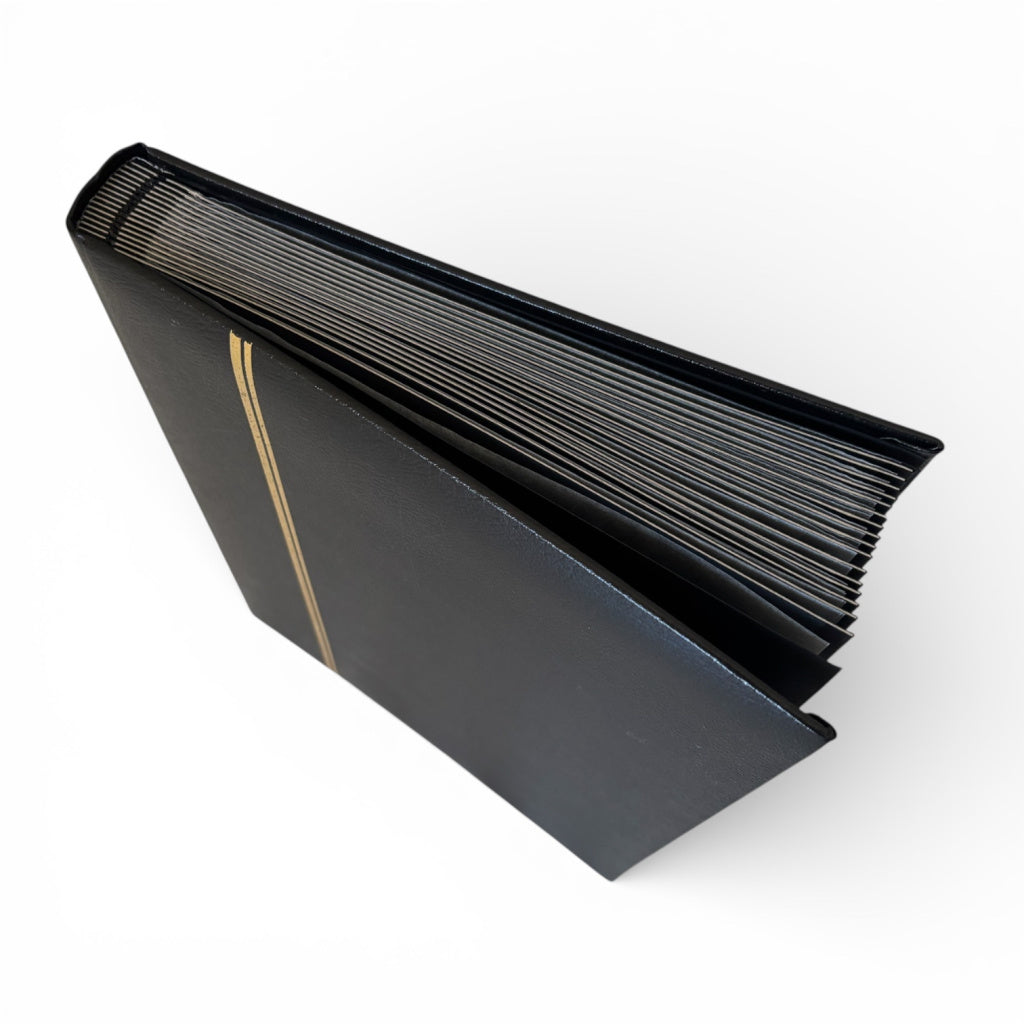 Black leather-bound stamp stockbook on a white background