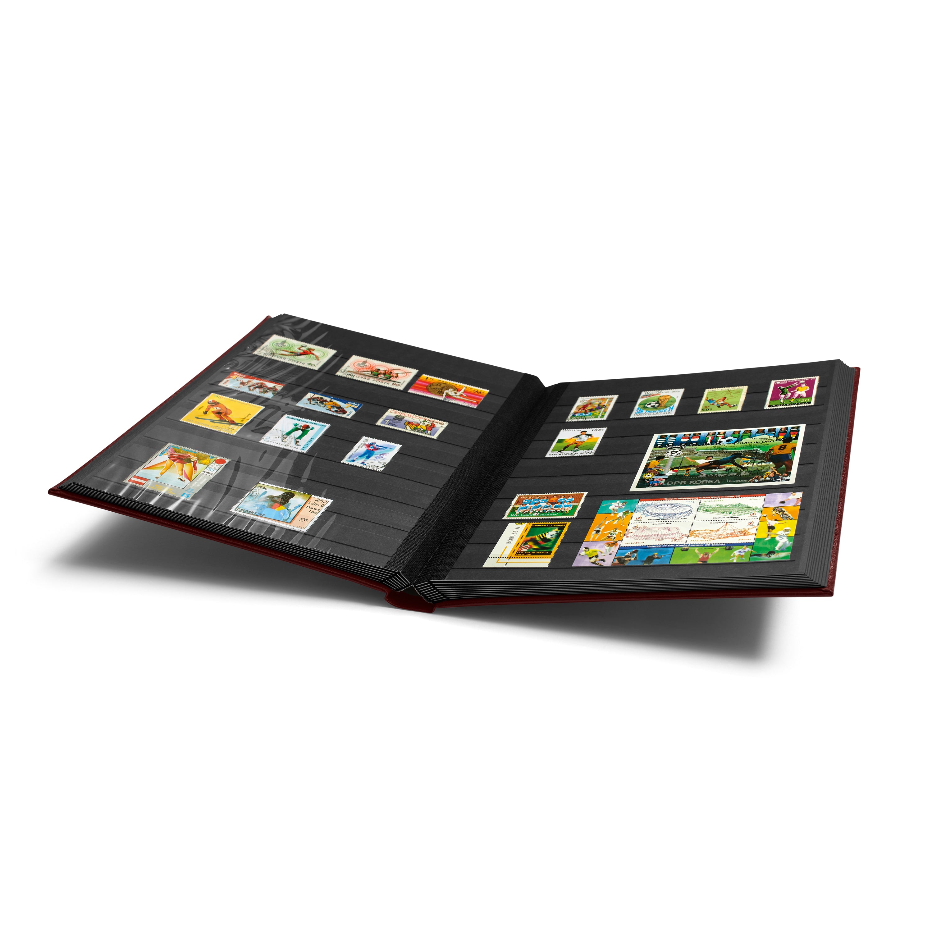 Open red stamp album stockbook with black pages holding a collection of stamps on a white background