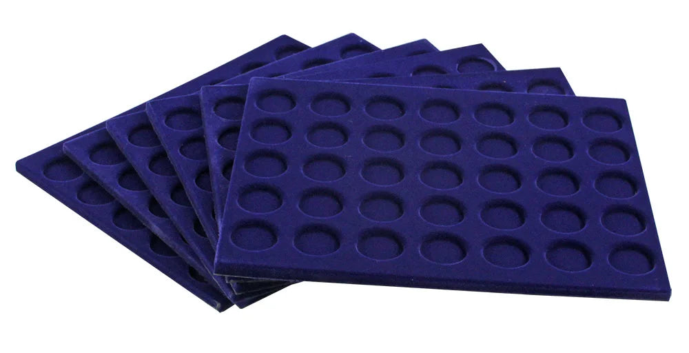 Set of blue velvet coin trays each with 35 round compartments on a white background