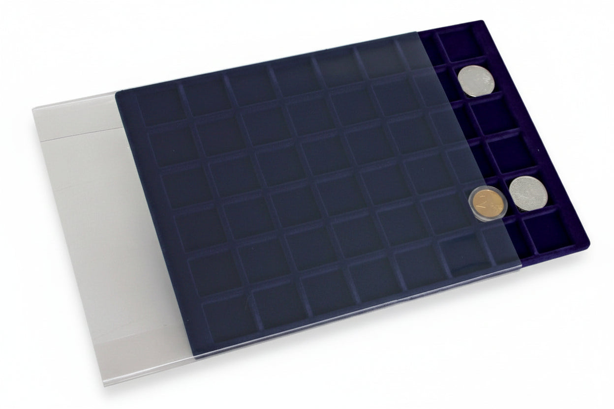 Blue velvet tray with square compartments holding a coin collection, halfway slid into an acrylic protective cover on a white background