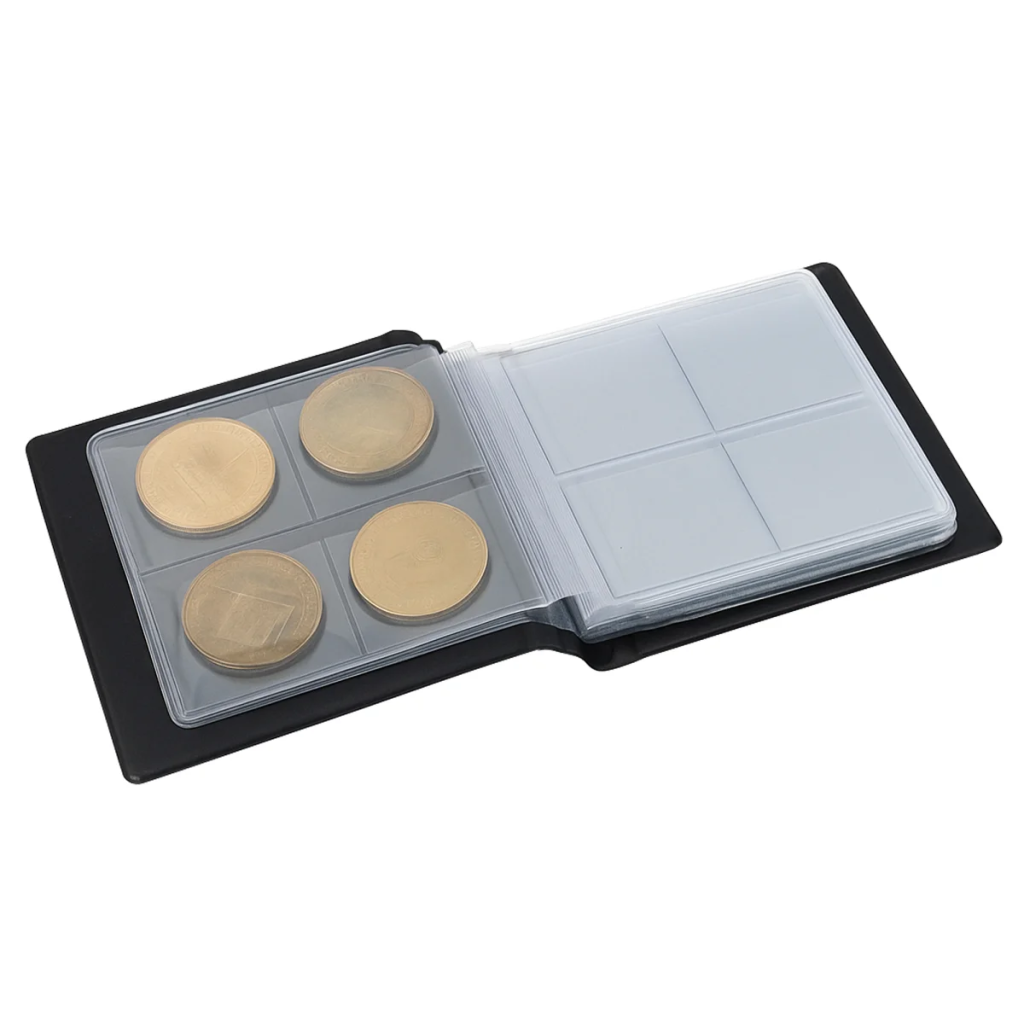Coin collection in an open black pocket-sized coin album on a white background