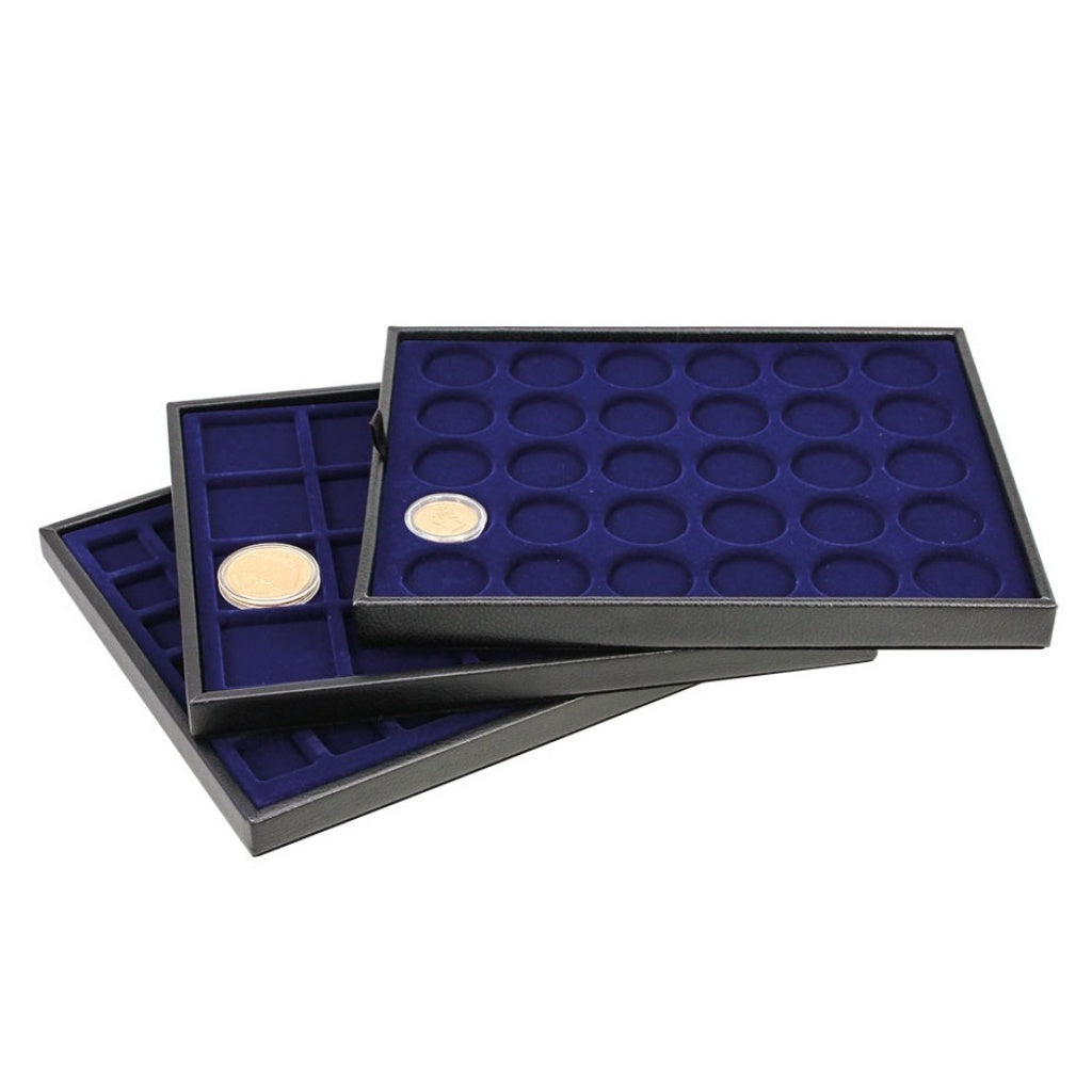 Stack of of 3 coin trays inside the leather tray holders, with various coins on a white background