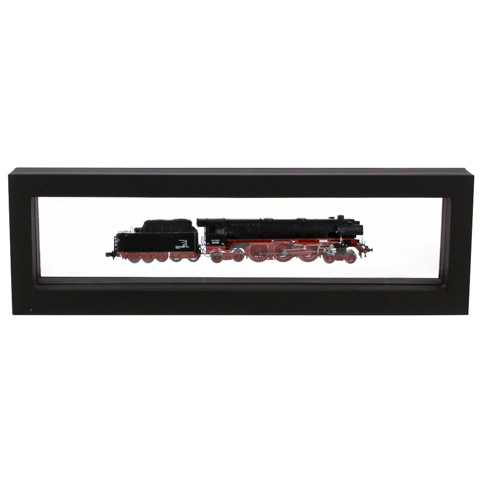 Black rectangular frame/shadowbox with transparent window made of film that is molded to a model train on a white background