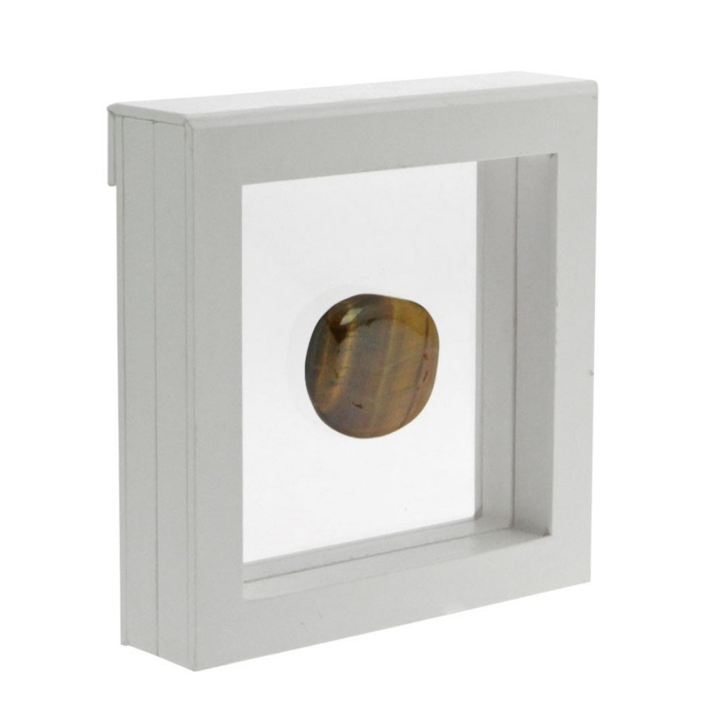 White square frame/shadowbox with transparent window made of film that is molded to a stone on a white background