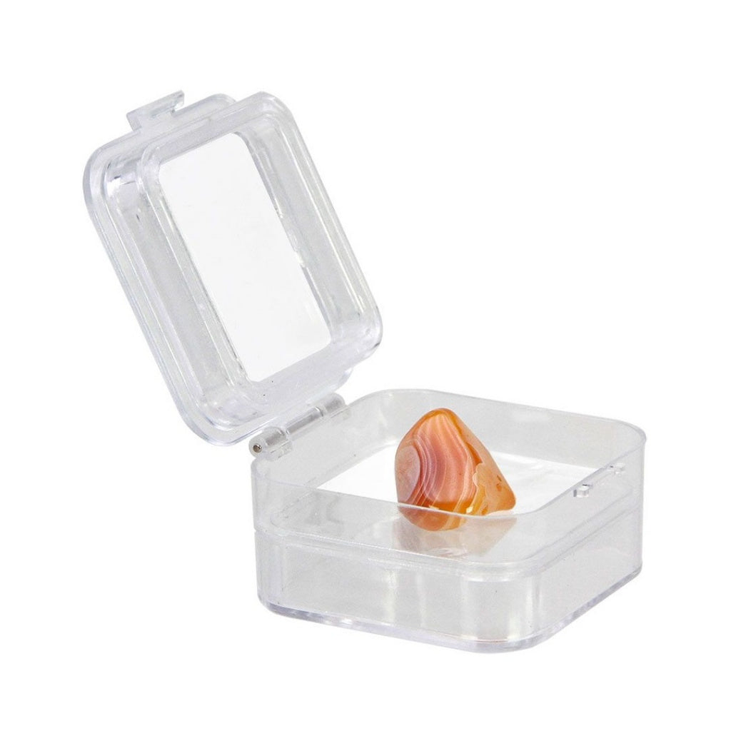 Open clear container with an internal flexible film that will be molded to a stone once closed on a white background