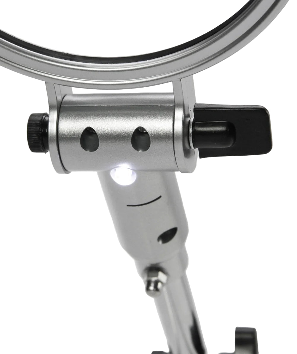 Close up of the metal magnifying glass with adjustable arm with black fixtures on a white background
