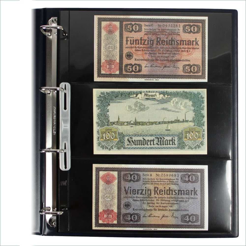 Open blue collection album displaying a page with 3 vintage german banknotes on a white background