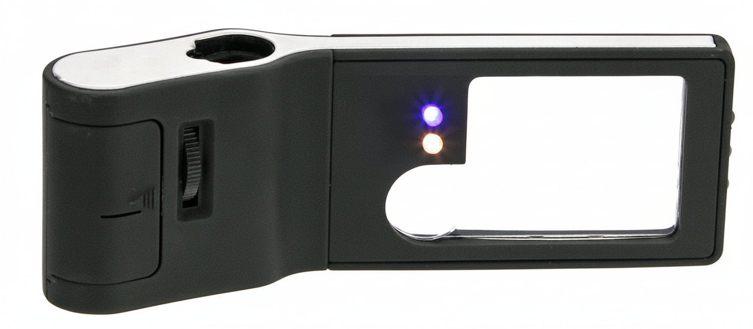 Two lens, black magnifying glass with LED and UV light with focus wheel on a white background