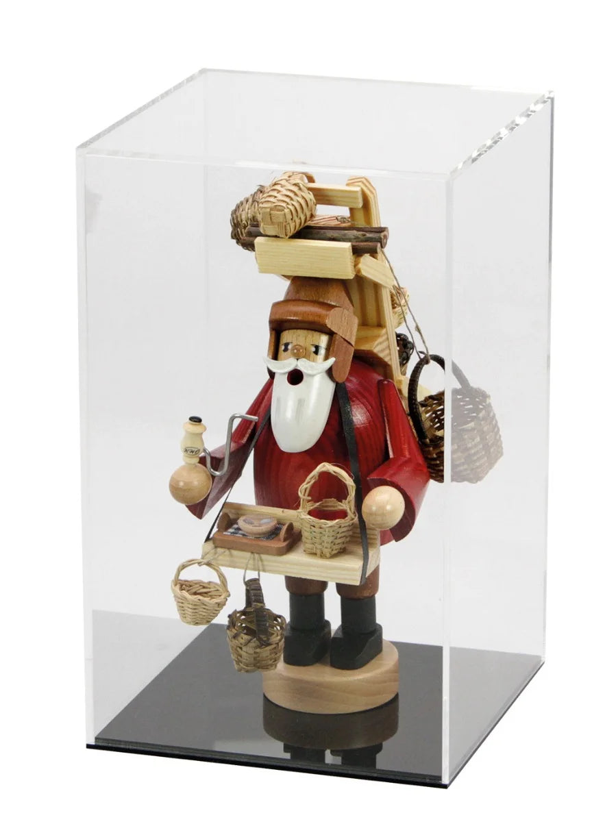 Wooden santa nutcracker figure inside acrylic display cube case with thin black base on a white background