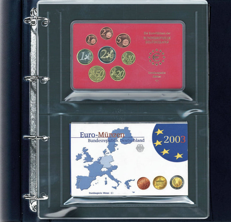 Open collection album displaying a page with 2 collectible coin proof sets on a white background