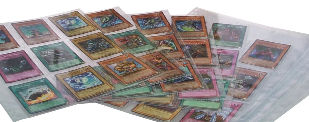 Collection of trading cards inside transparent collector album pages on a white background