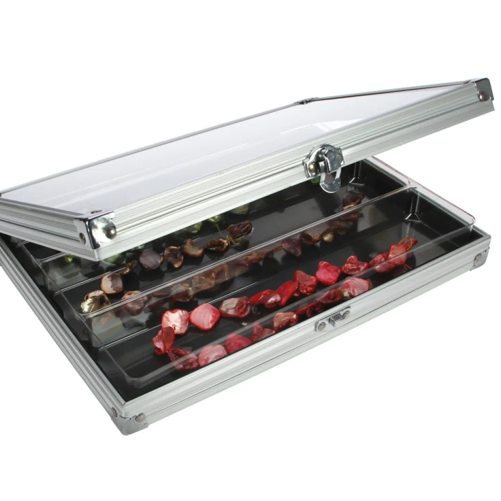 Aluminum display case with 3 compartments filled with rocks & mineral strings, open ajar with an acrylic lid on a white background