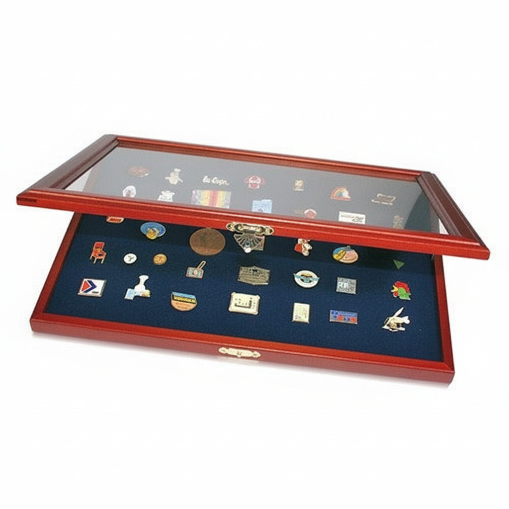 Wooden display case with a blue velvet interior holding various trading / collectible pins on a white background