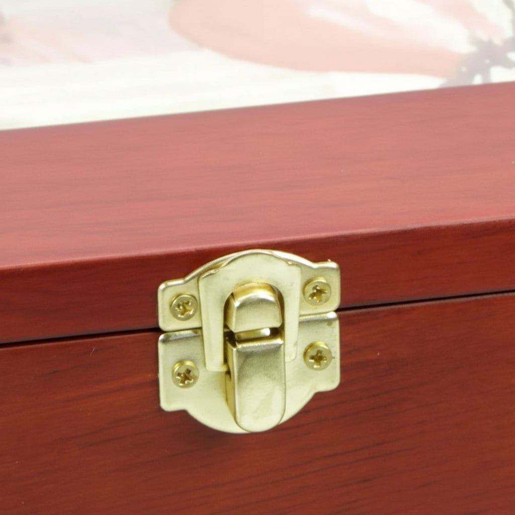 Close-up of the wooden postcard/photo storage box to show the brass snap-latch.