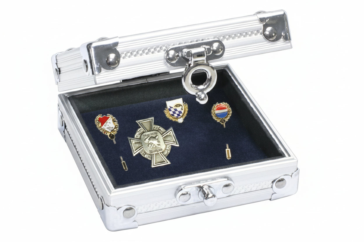 aluminum display case with decorative pins on a blue velvet insert on a white background