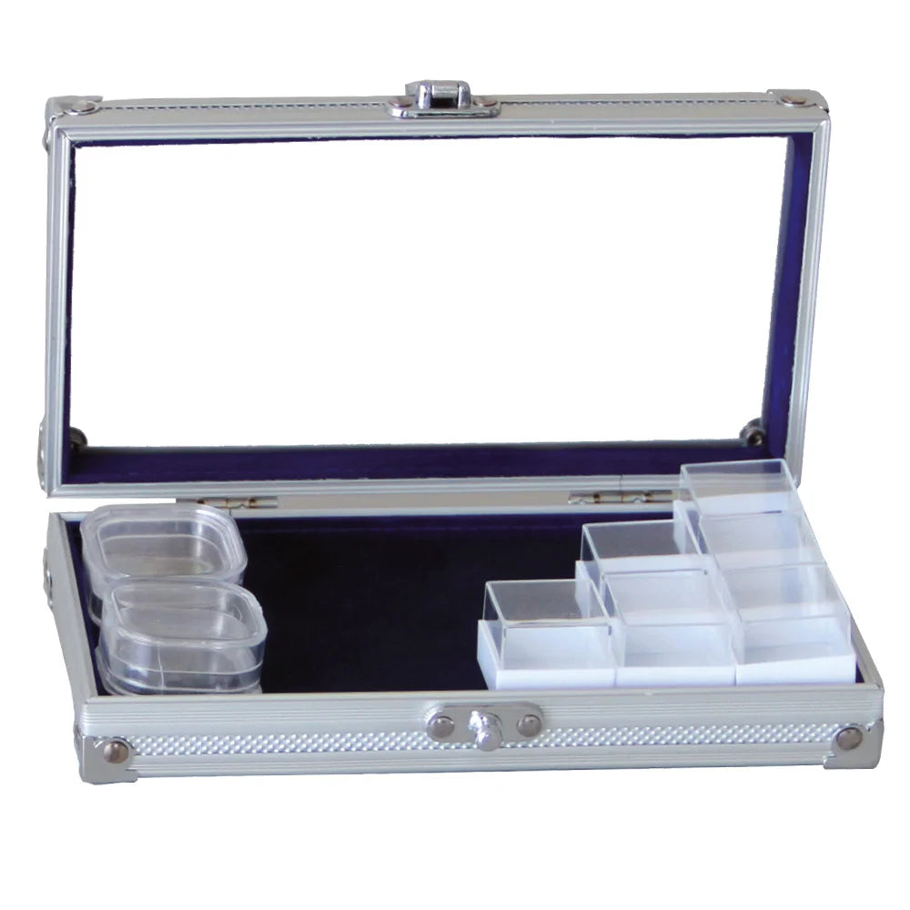 Aluminum Display case with an open acrylic lid and a blue interior containing various square capsules on a white background
