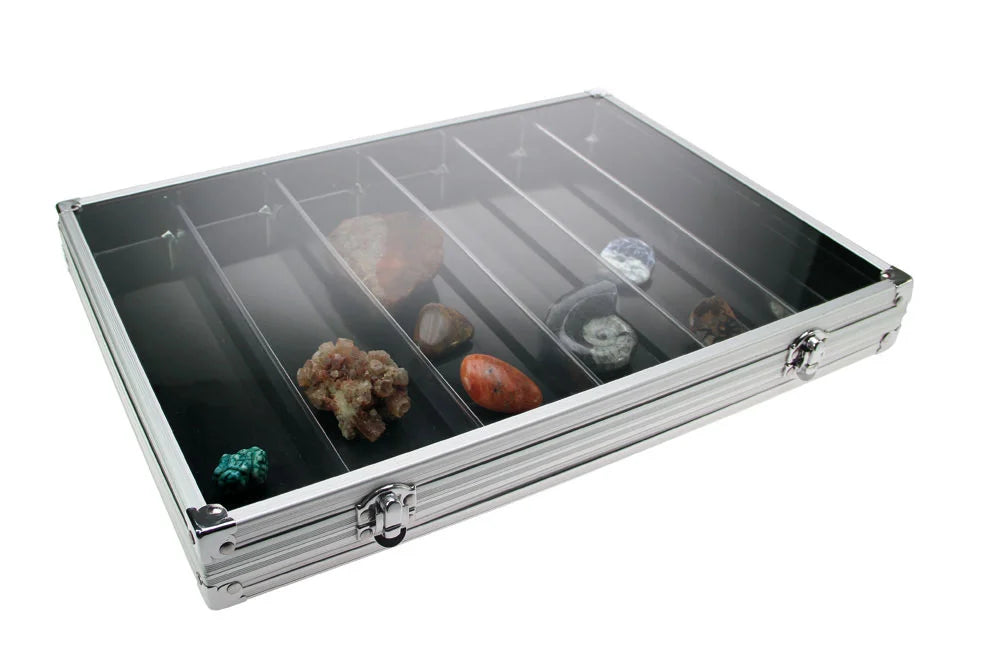 Aluminum display case with 6 compartments filled with rocks & minerals closed with an acrylic lid on a white background