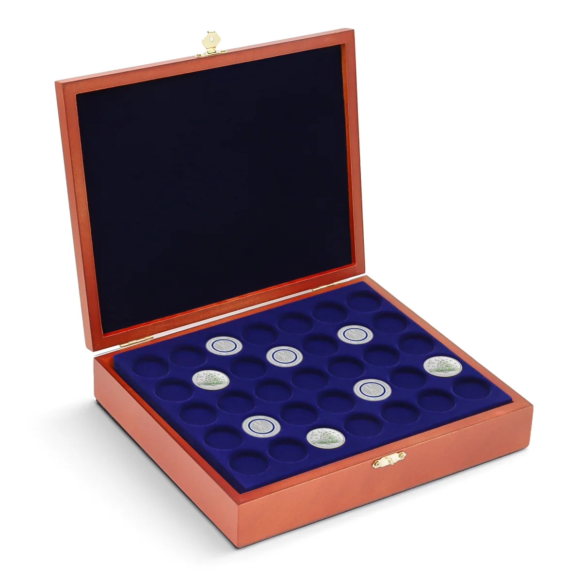 Open wooden coin collection box with blue velvet trays holding silver coins on a white background