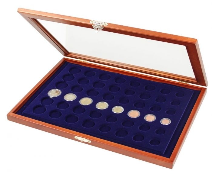 Wooden display case with blue velvet interior with 42 round compartments and glass lid for 6 euro sets in capsules on a white background