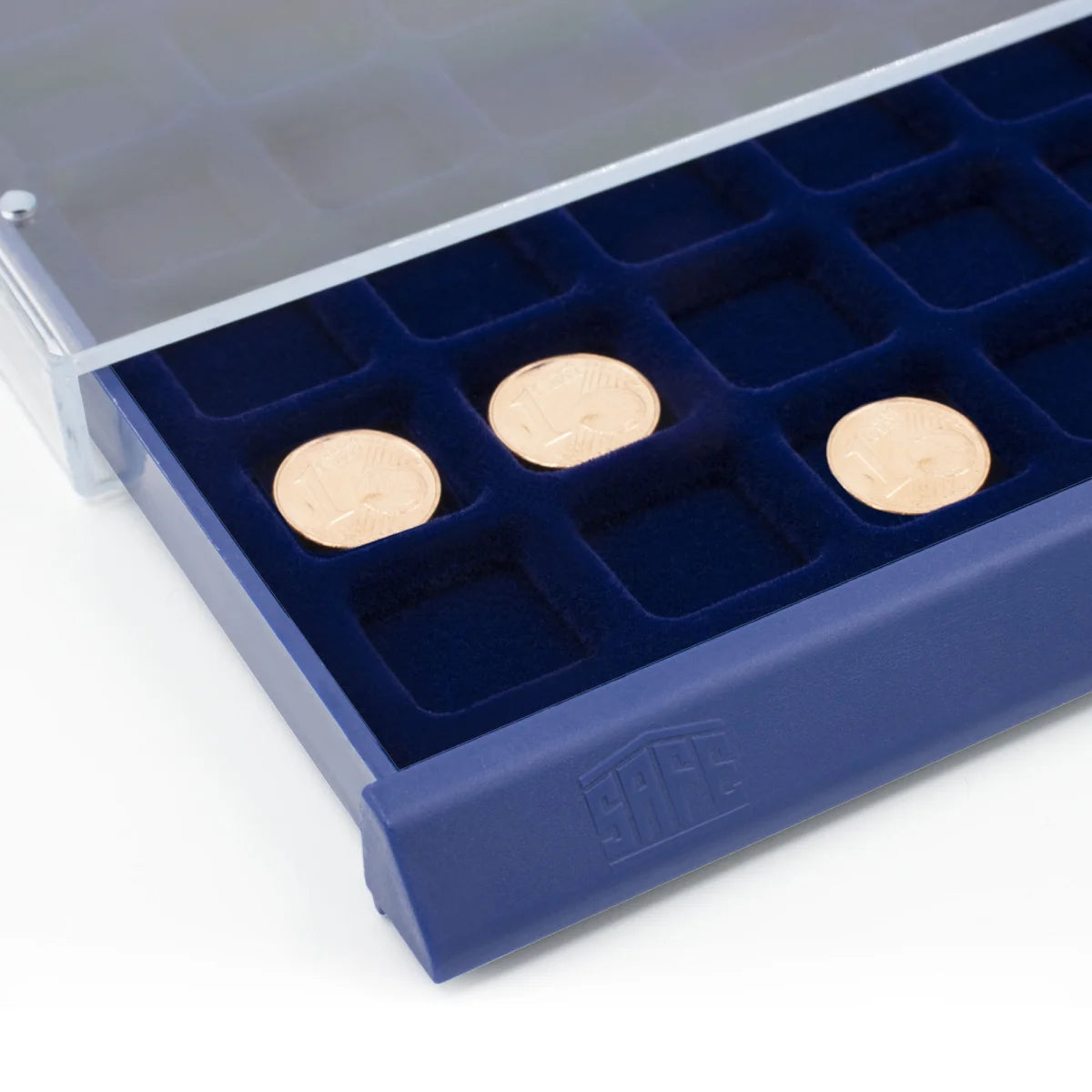 Detail image of open acrylic stackable drawer unit with a blue velvet tray and square compartments with coins on a white background