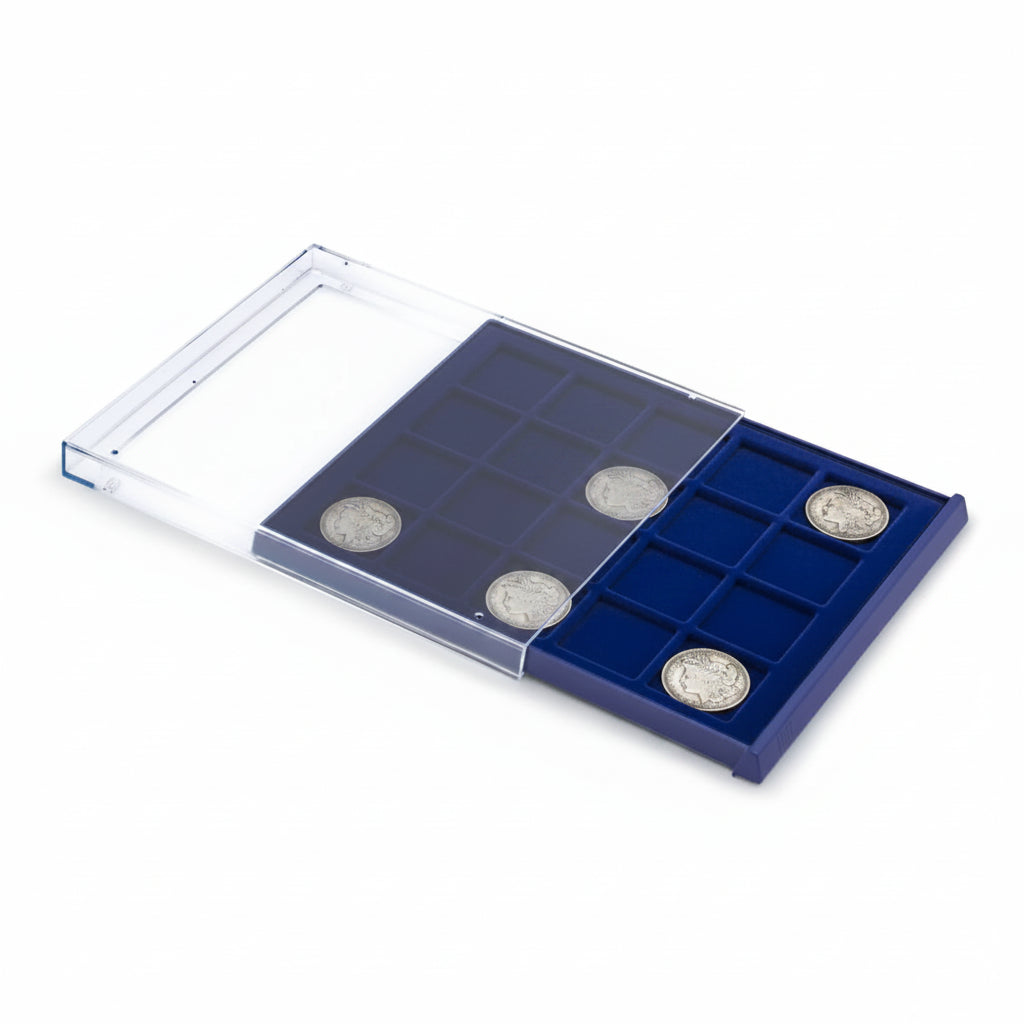 Open acrylic stackable drawer unit with a blue velvet tray and square compartments with morgan dollar coins on a white background