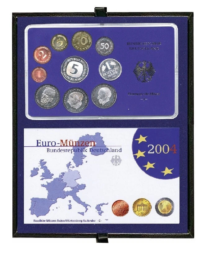 Two coin proof sets arranged in a deep blue velvet coin tray inside a leather tray holder, photographed against a plain white background.