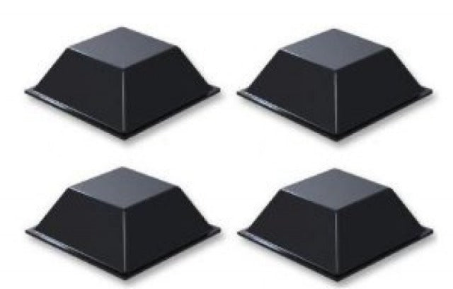 Four black coin case self-adhesive feet on a white background