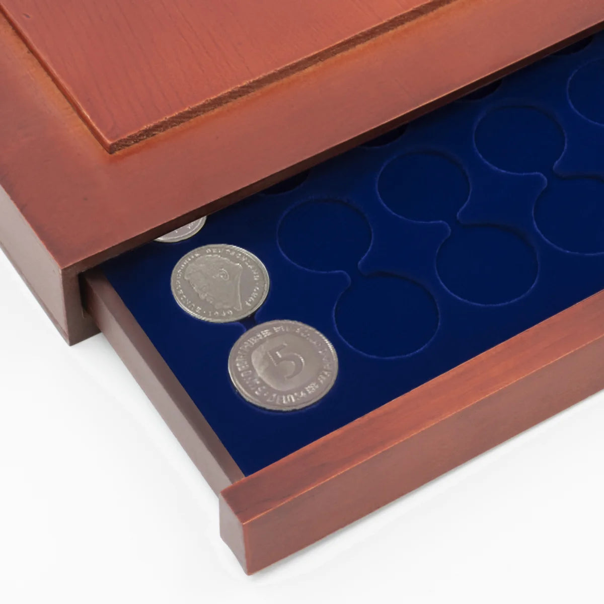 Detail shot of open wooden stackable drawer unit with a blue velvet tray for euro coin sets on a white background