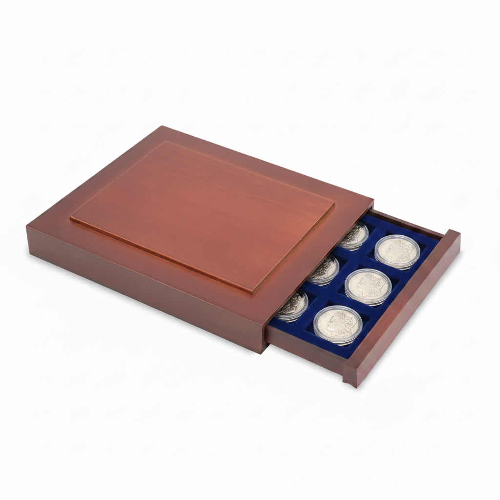 Open wooden stackable drawer unit with a blue velvet tray with square compartments for morgan dollar coins in capsules on a white background