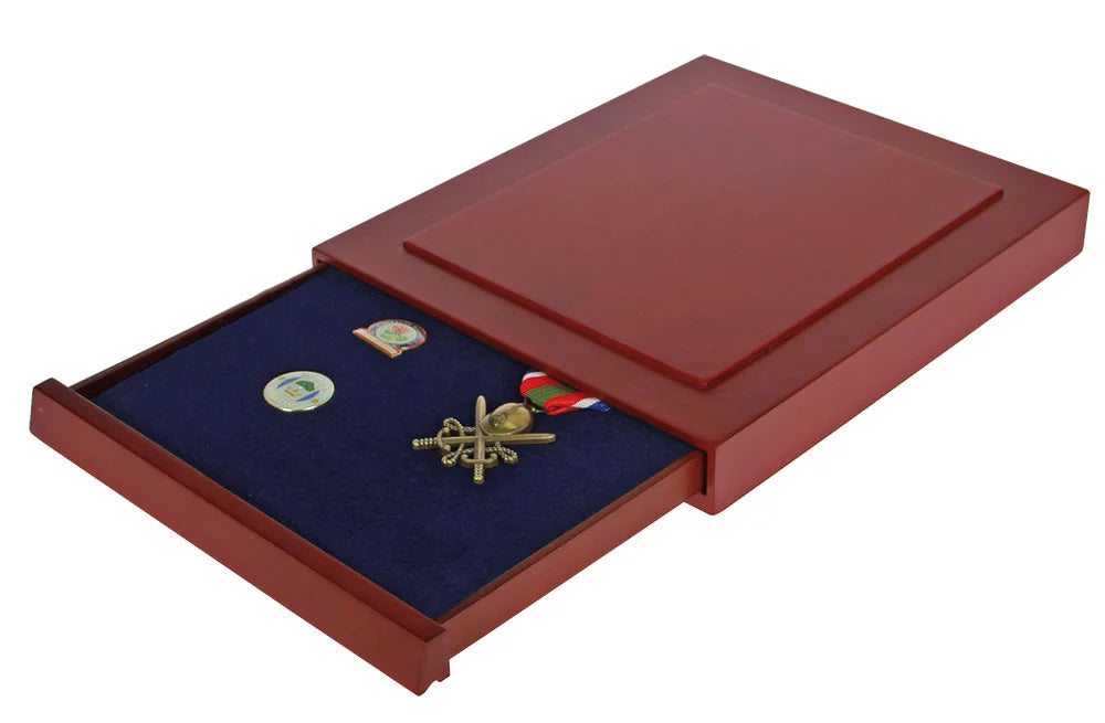 Open wooden stackable drawer with blue interior holding three collectible pins & military medals on a white background