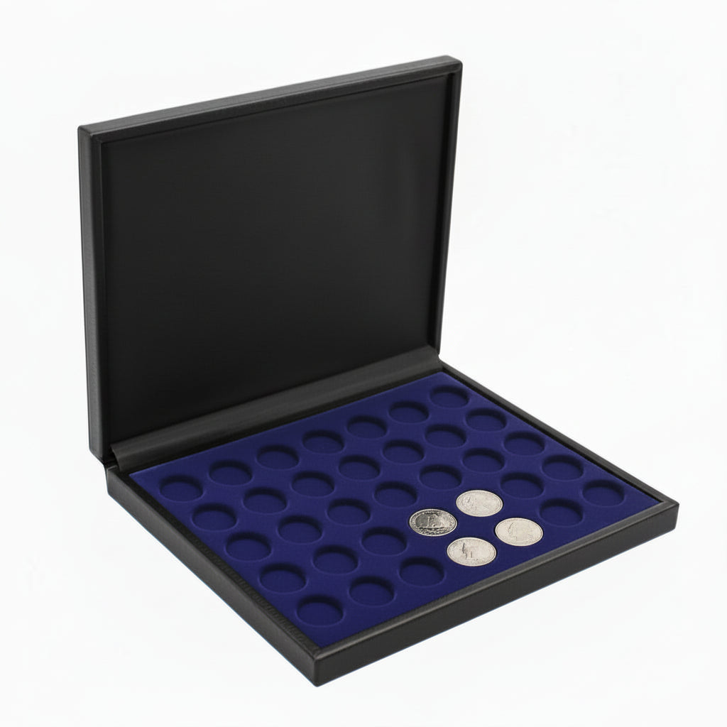 A blue velvet tray with silver coins in an open black leather coin presentation case, on a white background.