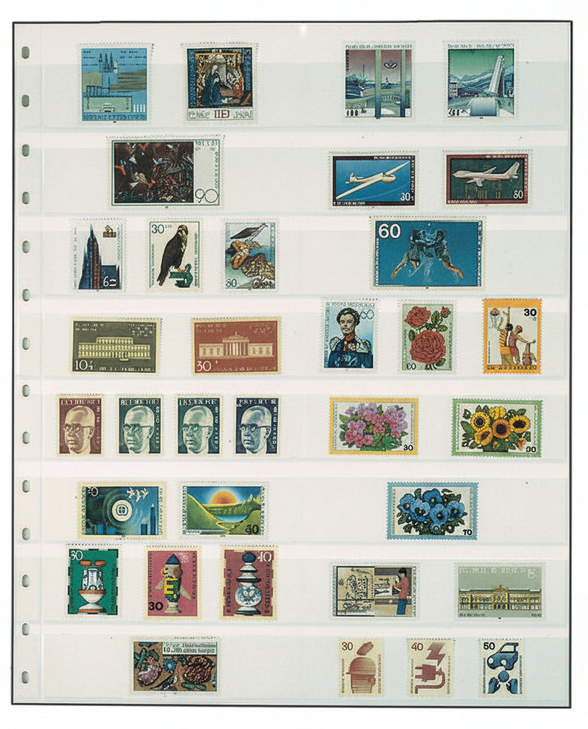 Collection of various stamps on a white stamp album page on a white background
