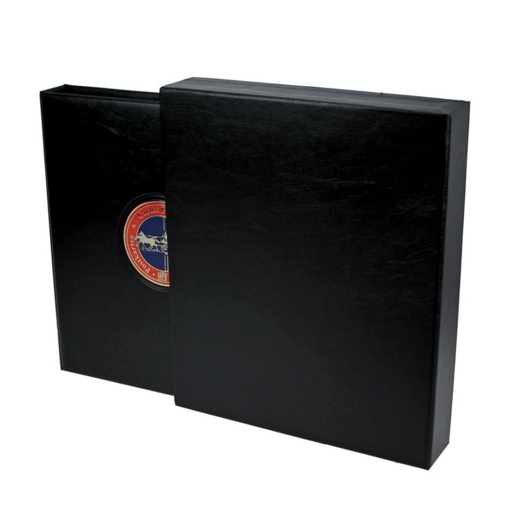 Black ARTline Album being inserted into the black ARTline slipcase on a white background