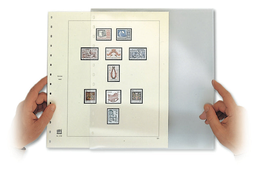 Collection of stamps on a stamp album page held by hands being slipping into a protective cover on a white background