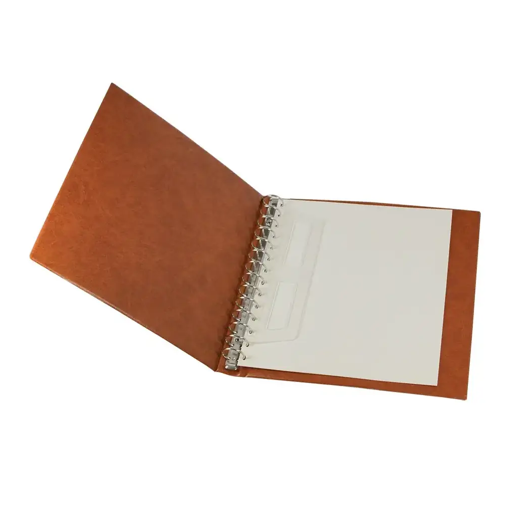 Open brown collector album showing 14-ring mechanism with white end pages on a white background