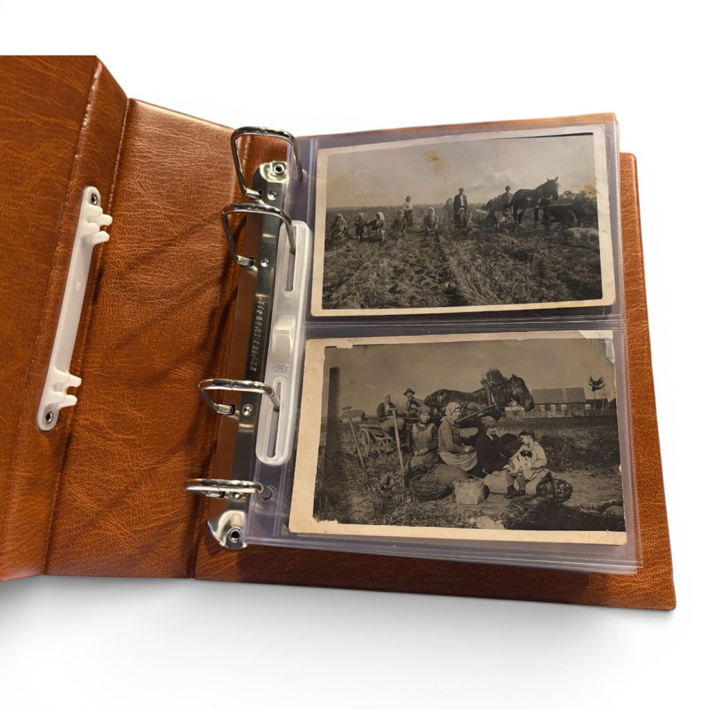 Open tan album with black and white photos of people and horses on a white background