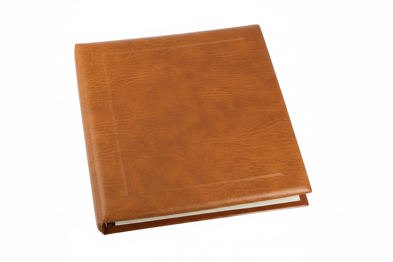 Closed tan padded album on a white background