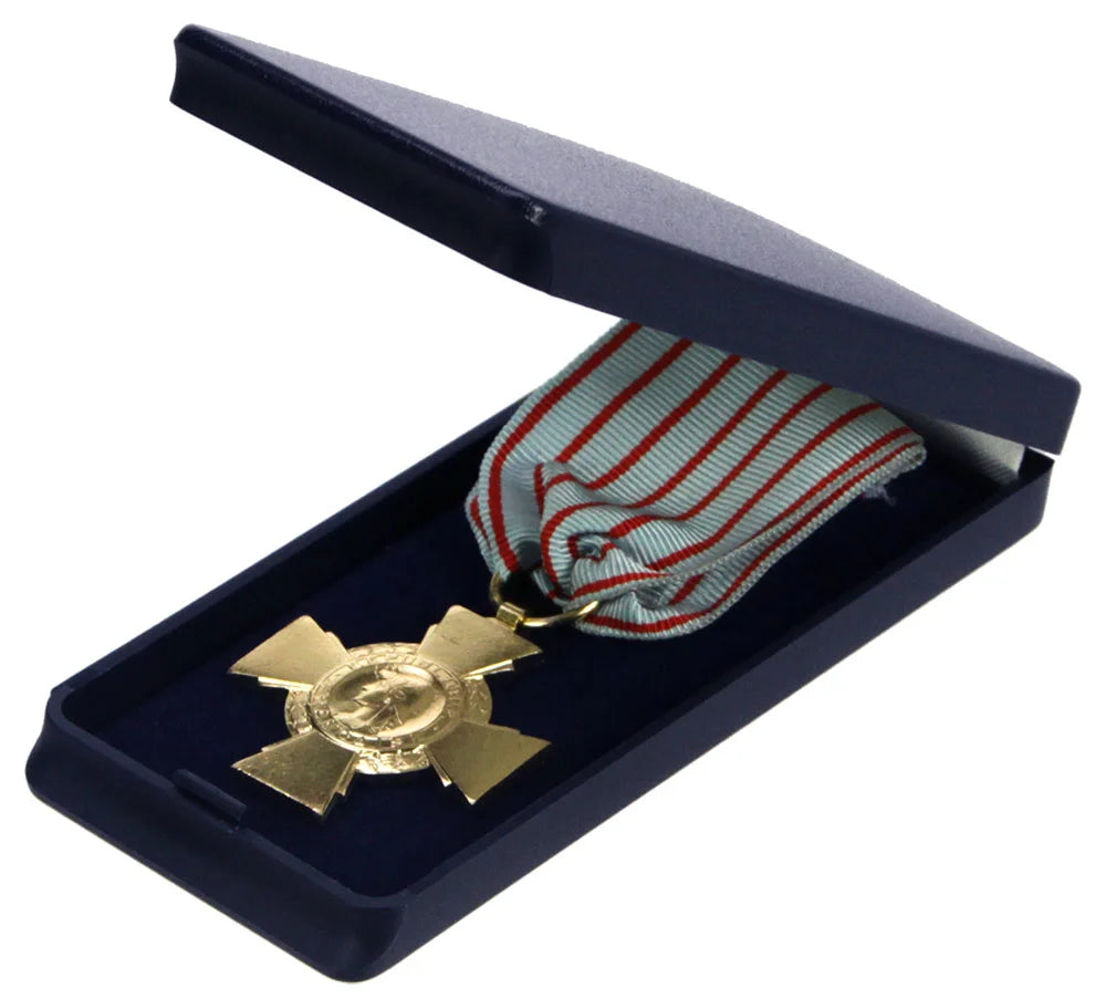 Gold medal with a red and white striped ribbon in an open navy blue display case on a white background.