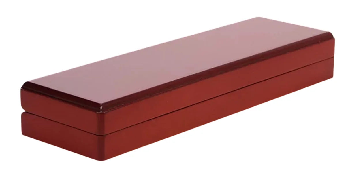 Closed wooden coin box on a white background