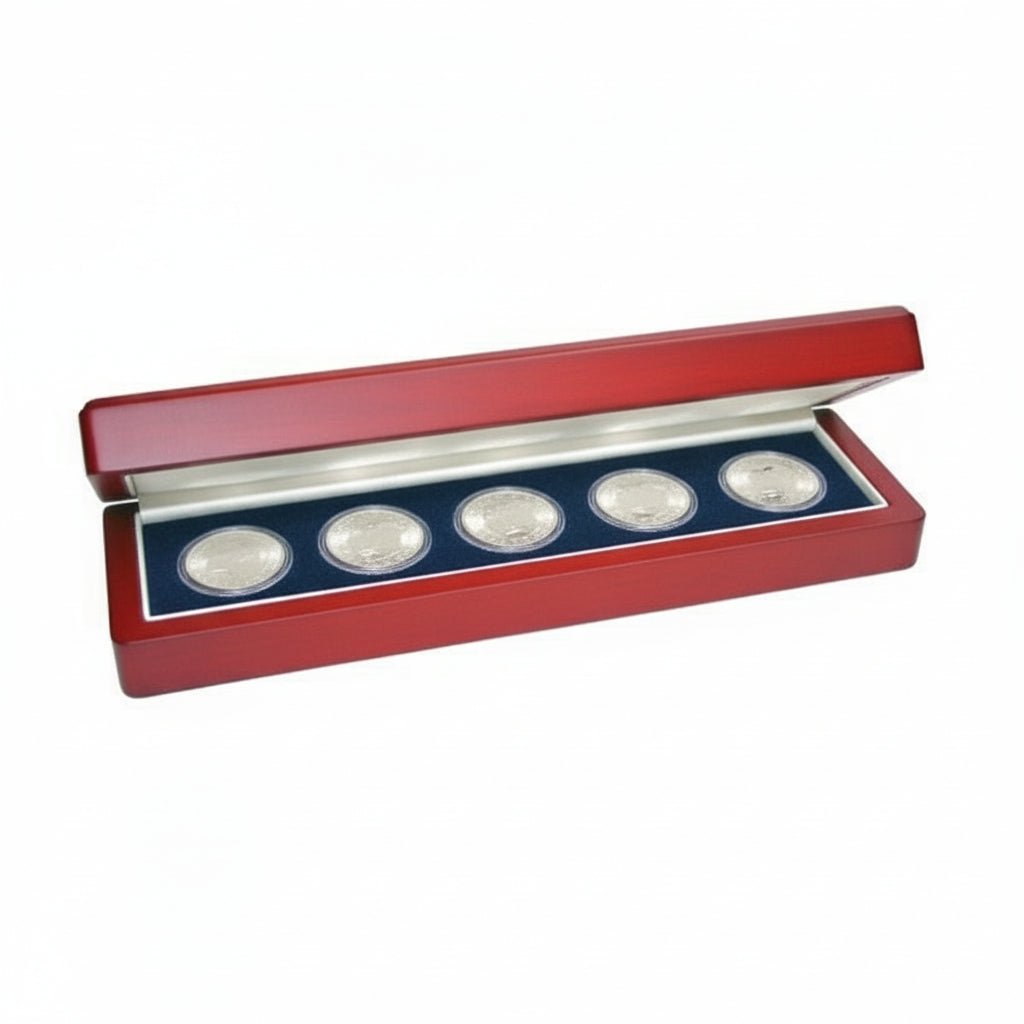 Set of five silver coins in a wooden display case with a blue velvet impressionable foam insert with cream lining on a white background