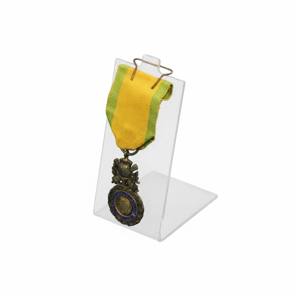 Medal with yellow ribbon on a clear stand / easel against a white background